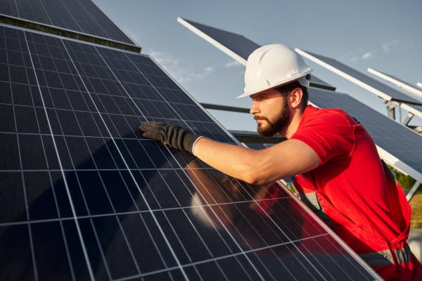 Engineer cleaning solar panel