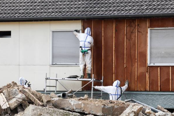 Professionals assess and repair the roof